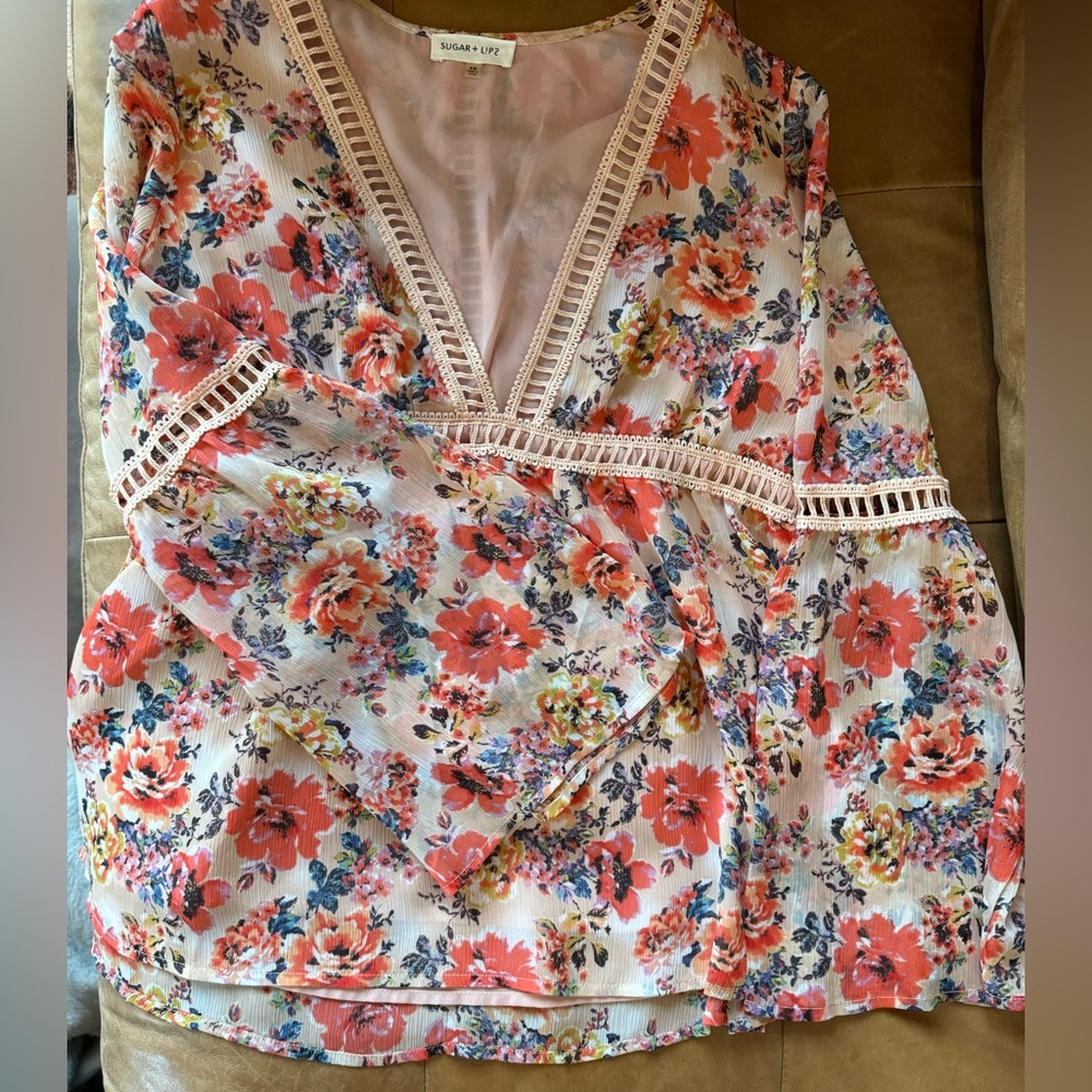 Floral 1970s inspired blouse with bell sleeves